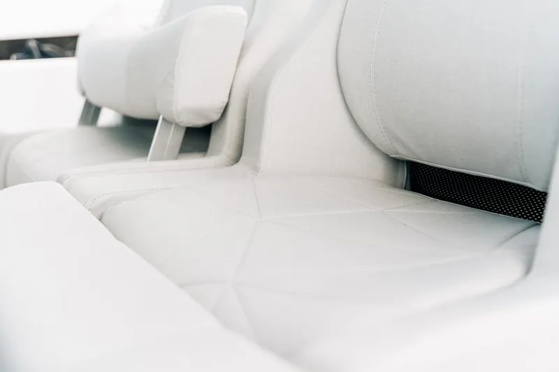 Slide: The Image of 2026 Axopar AX29 CCX boat cruising on open water, aerial view. - 16