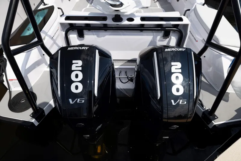 Slide: The Image of 2026 Axopar AX29 CCX boat interior with modern console and waterfront view. - 22