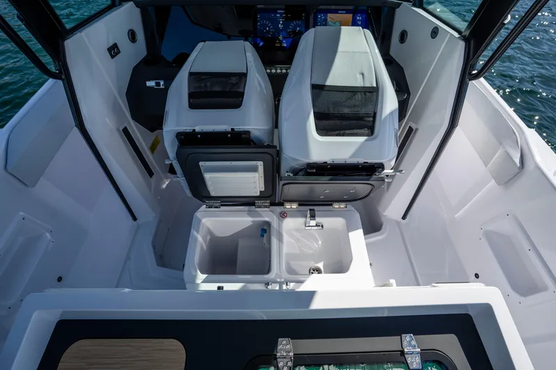 Slide: The Image of 2026 Axopar AX29 CCX boat interior with seating, storage, and control panel. - 27