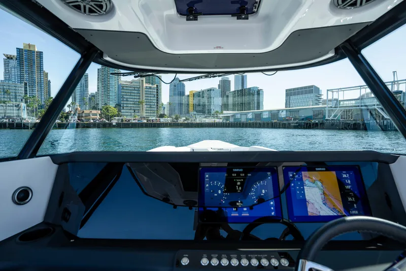 Slide: The Image of 2026 Axopar AX29 CCX boat dashboard with city skyline view. - 31