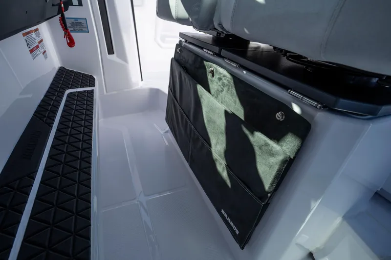 Slide: The Image of Interior view of 2026 Axopar AX29 CCX boat, featuring seating and storage area. - 36