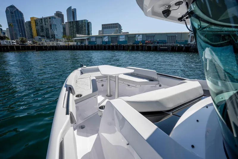 Slide: The Image of 2026 Axopar AX29 CCX boat docked in urban waterfront setting. - 38