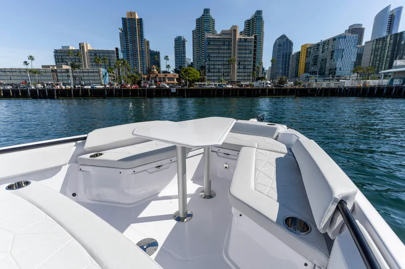 Slide: The Image of 2026 Axopar AX29 CCX boat interior with city skyline in background. - 39