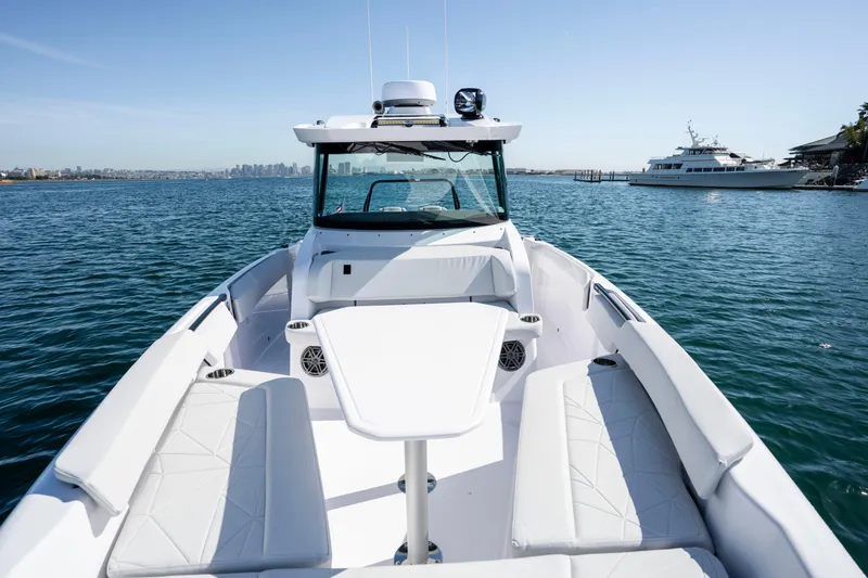 Slide: The Image of 2026 Axopar AX29 CCX boat on water, featuring spacious seating and modern design. - 43