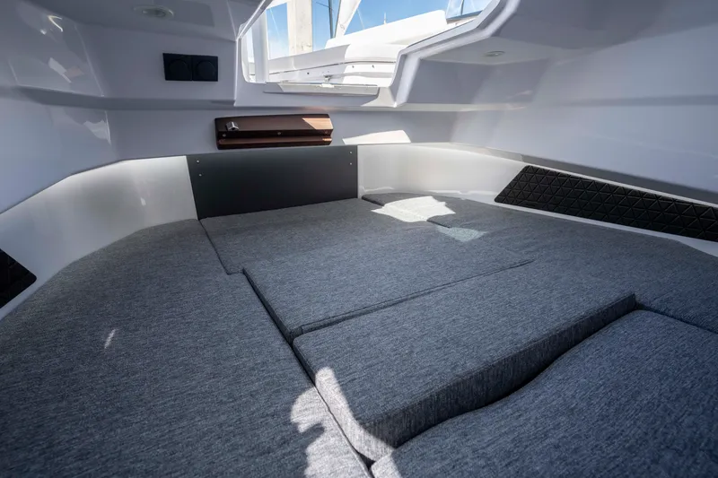 Slide: The Image of Interior cabin of 2026 Axopar AX29 CCX boat with cushioned seating. - 46