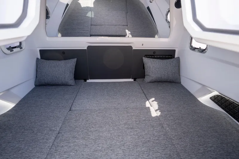 Slide: The Image of 2026 Axopar AX29 CCX cabin interior with gray cushions and modern design. - 47