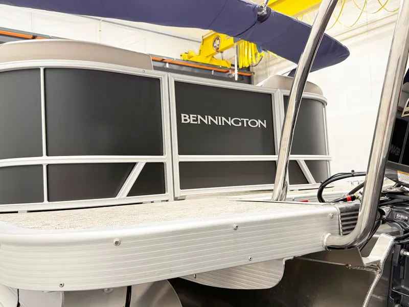 Slide: The Image of 2025 Bennington 20 S STERN RADIUS boat cockpit with steering wheel and control panel. - 5