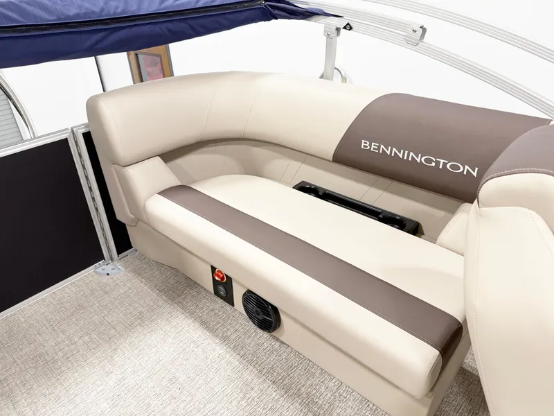 Slide: The Image of 2025 Bennington 20 S STERN RADIUS boat interior with beige and brown seating. - 7