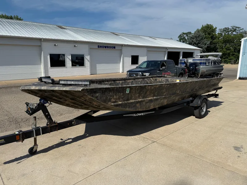 Slide: The Image of 2022 Lowe Roughneck RX2070 Tiller boat on trailer outside showroom. - 3