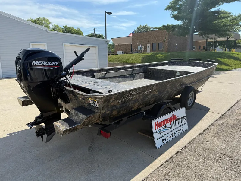Slide: The Image of 2022 Lowe Roughneck RX2070 Tiller boat with Mercury engine on trailer. - 7