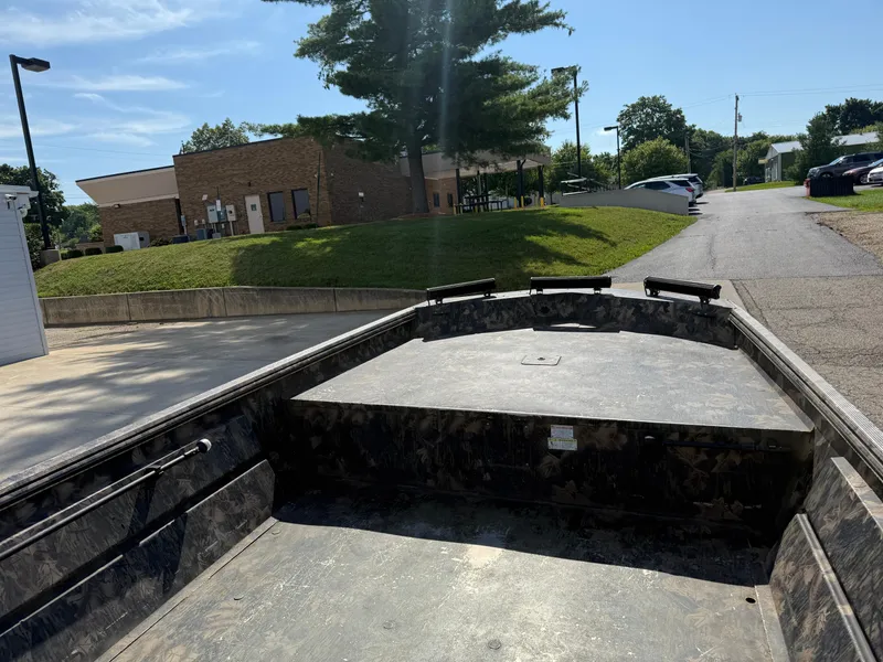 Slide: The Image of 2022 Lowe Roughneck RX2070 Tiller boat parked outdoors on a sunny day. - 8