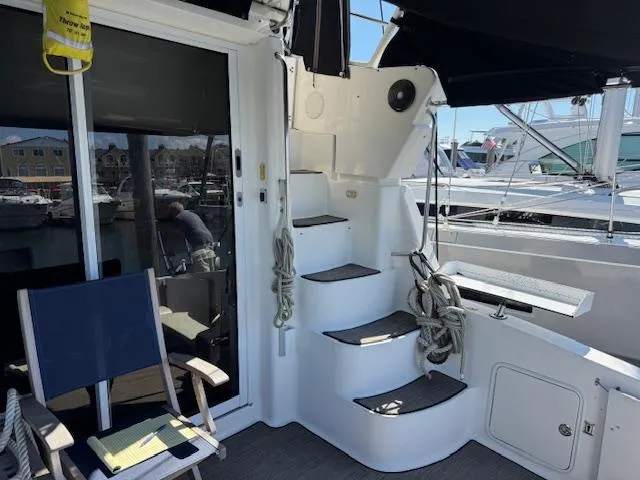 Slide: The Image of 2001 Silverton 35 Convertible yacht interior with stairs and seating area. - 12
