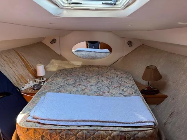 Slide: The Image of Cozy cabin interior of 2001 Silverton 35 Convertible yacht with bed and skylight. - 18