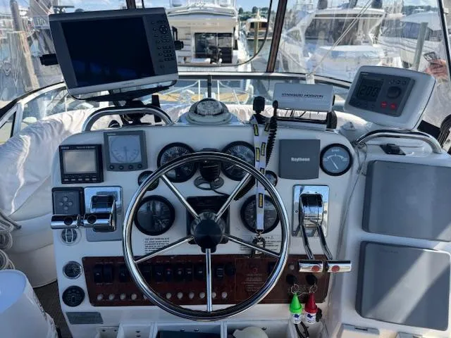Slide: The Image of Helm of 2001 Silverton 35 Convertible with navigation equipment and steering wheel. - 5