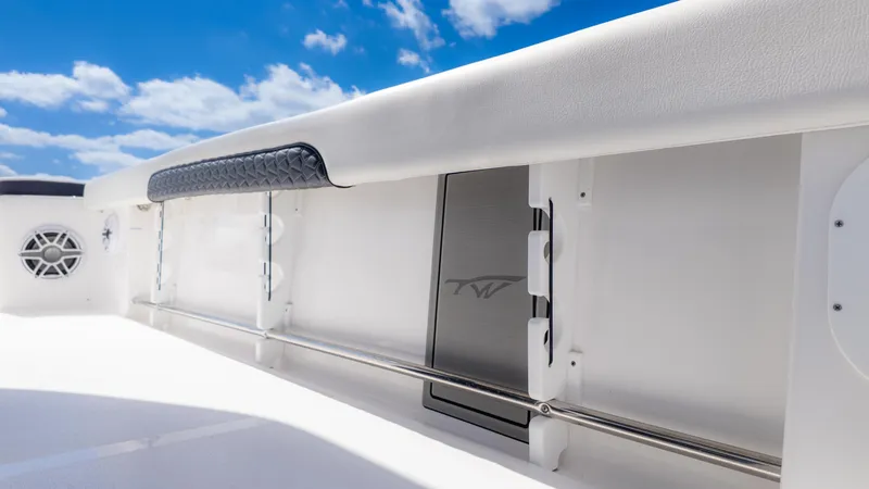 Slide: The Image of 2025 Tidewater 3100 Carolina Bay boat interior with sleek design and blue sky background. - 14