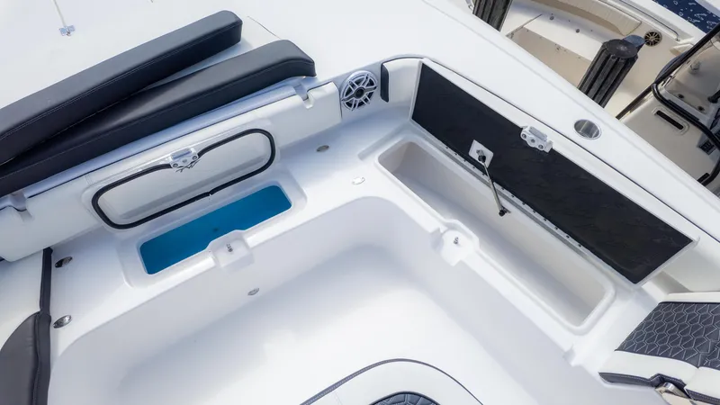 Slide: The Image of 2025 Tidewater 3100 Carolina Bay boat interior with storage compartments and seating. - 22