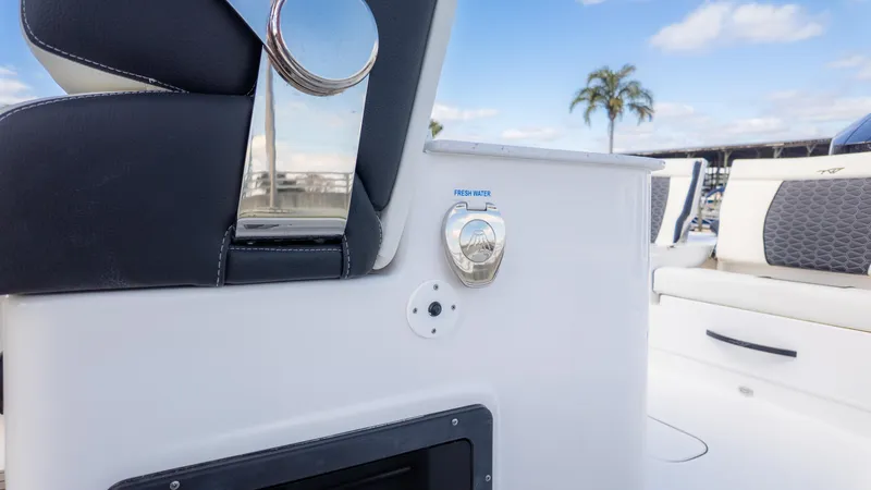 Slide: The Image of 2025 Tidewater 3100 Carolina Bay boat interior with fresh water access and seating. - 27