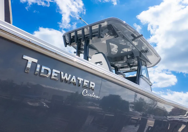 Slide: The Image of 2025 Tidewater 3100 Carolina Bay boat under a bright blue sky. - 8