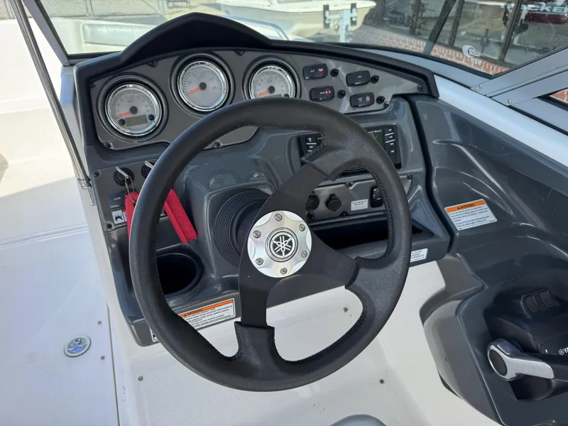 Slide: The Image of Steering wheel and dashboard of a 2012 Yamaha Boats SX210. - 11