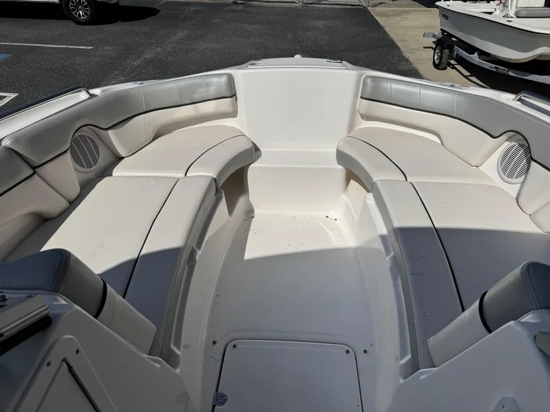 Slide: The Image of 2012 Yamaha SX210 boat interior with spacious seating and speakers. - 7