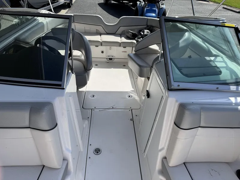 Slide: The Image of 2012 Yamaha Boats SX210 interior with seating and windshield, showcasing spacious design. - 8