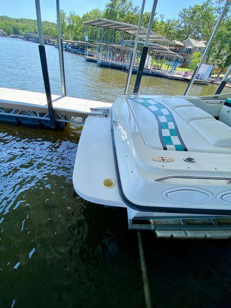 Slide: The Image of 1999 Checkmate 259 Convincer boat docked on a sunny lake. - 10