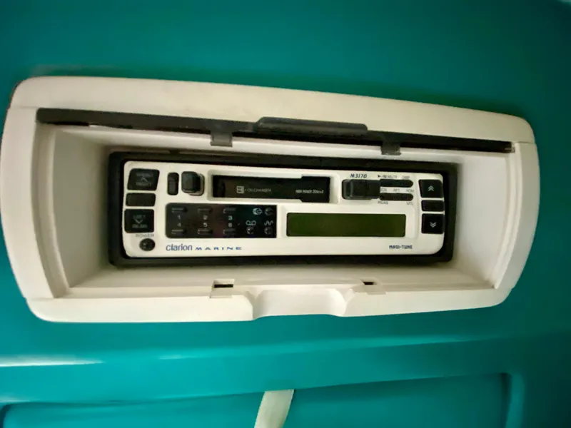 Slide: The Image of Clarion Marine radio in 1999 Checkmate 259 Convincer boat dashboard. - 28