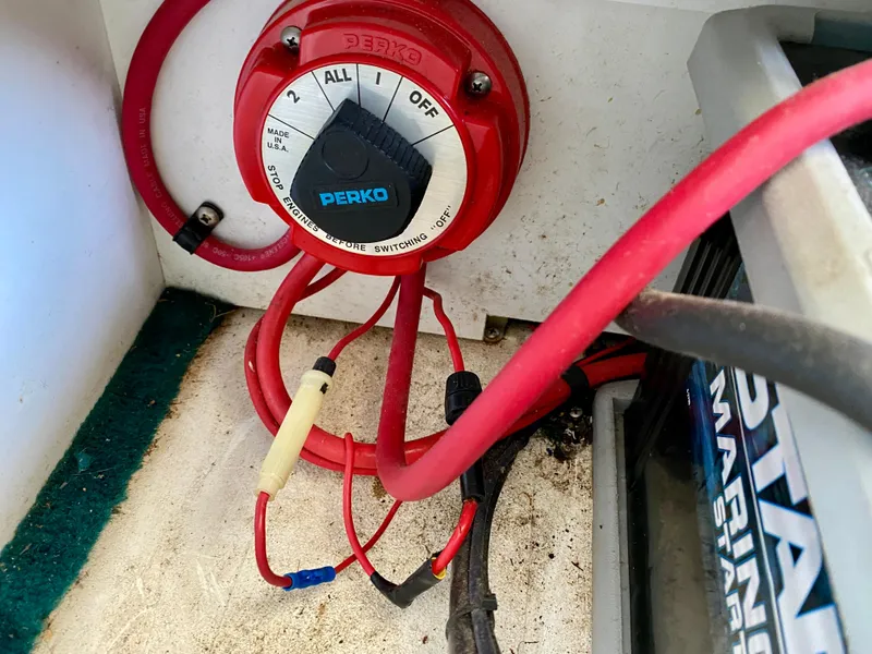 Slide: The Image of Battery switch and wiring inside a 1999 Checkmate 259 Convincer boat. - 33