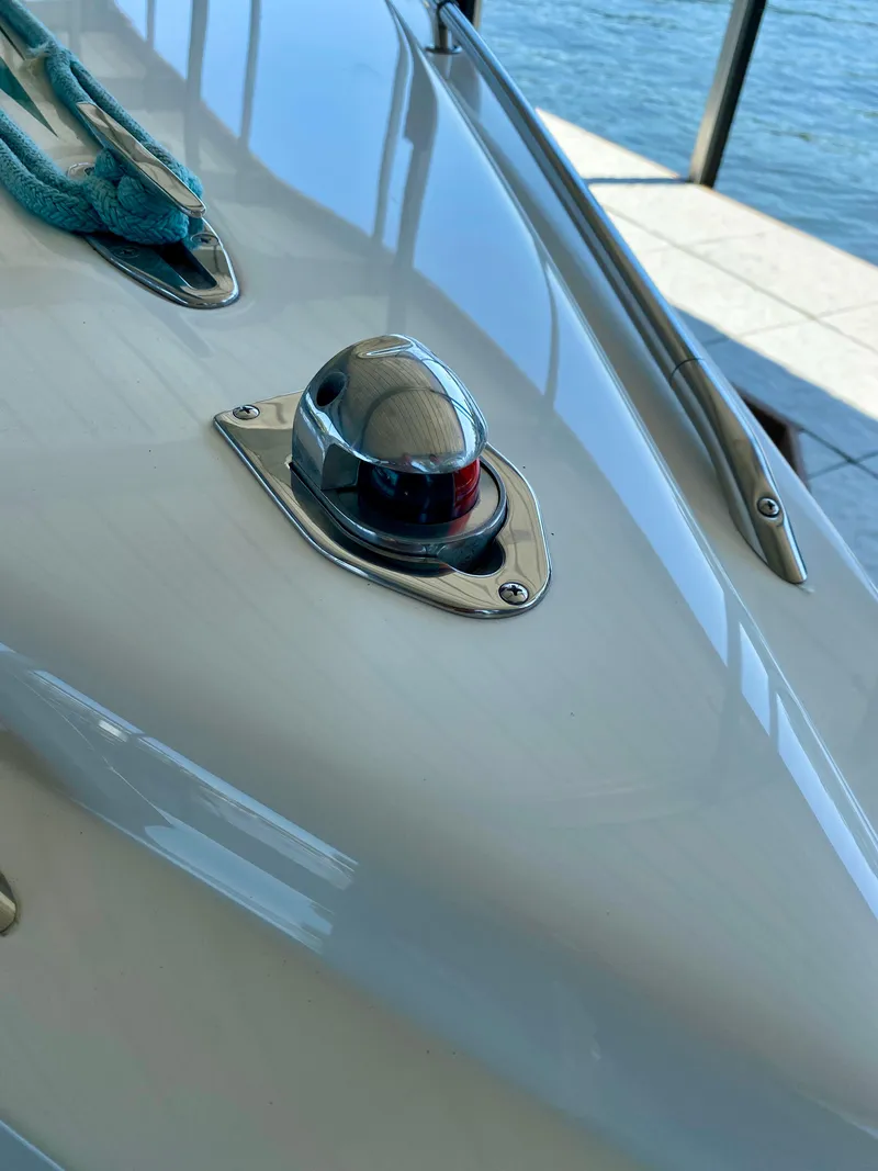 Slide: The Image of Close-up of 1999 Checkmate 259 Convincer boat's navigation light and deck details. - 9
