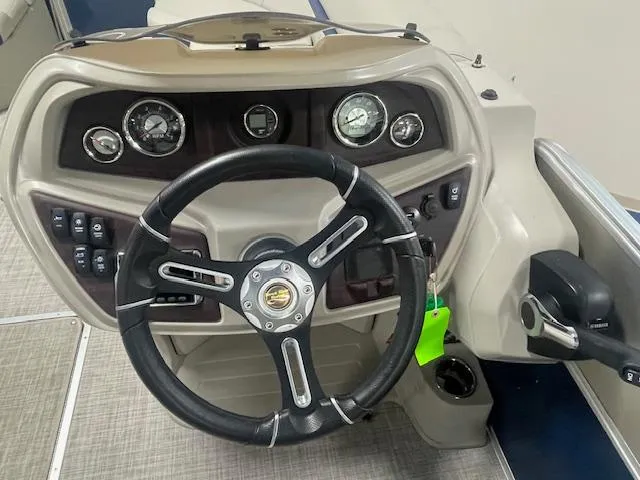Slide: The Image of Steering console of 2019 South Bay 224 RS 3.0 boat with gauges and controls. - 7