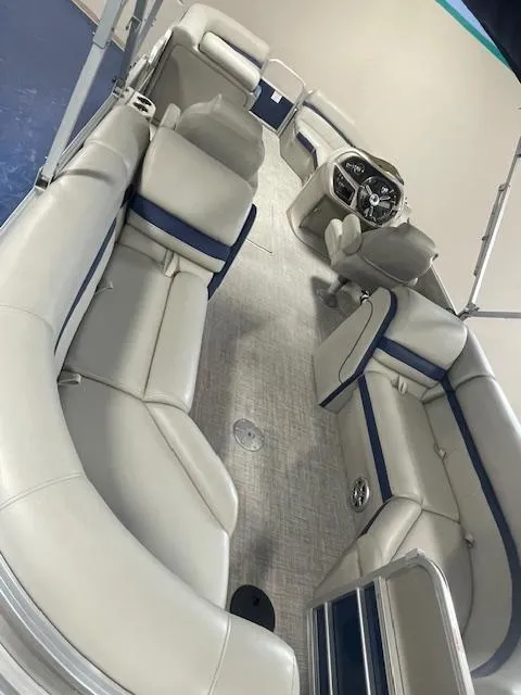 Slide: The Image of 2019 South Bay 224 RS 3.0 pontoon boat interior with plush seating and modern helm. - 9