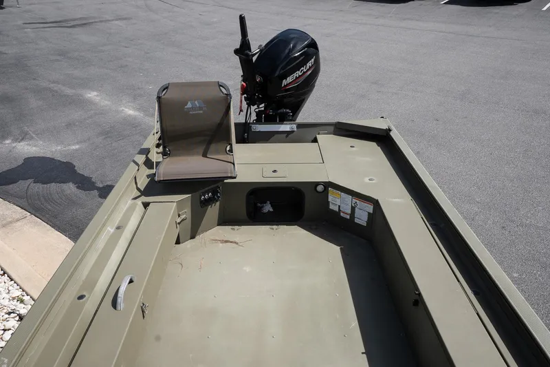 Slide: The Image of 2023 Tracker Grizzly 1654 T Sportsman boat interior with Mercury outboard motor. - 10