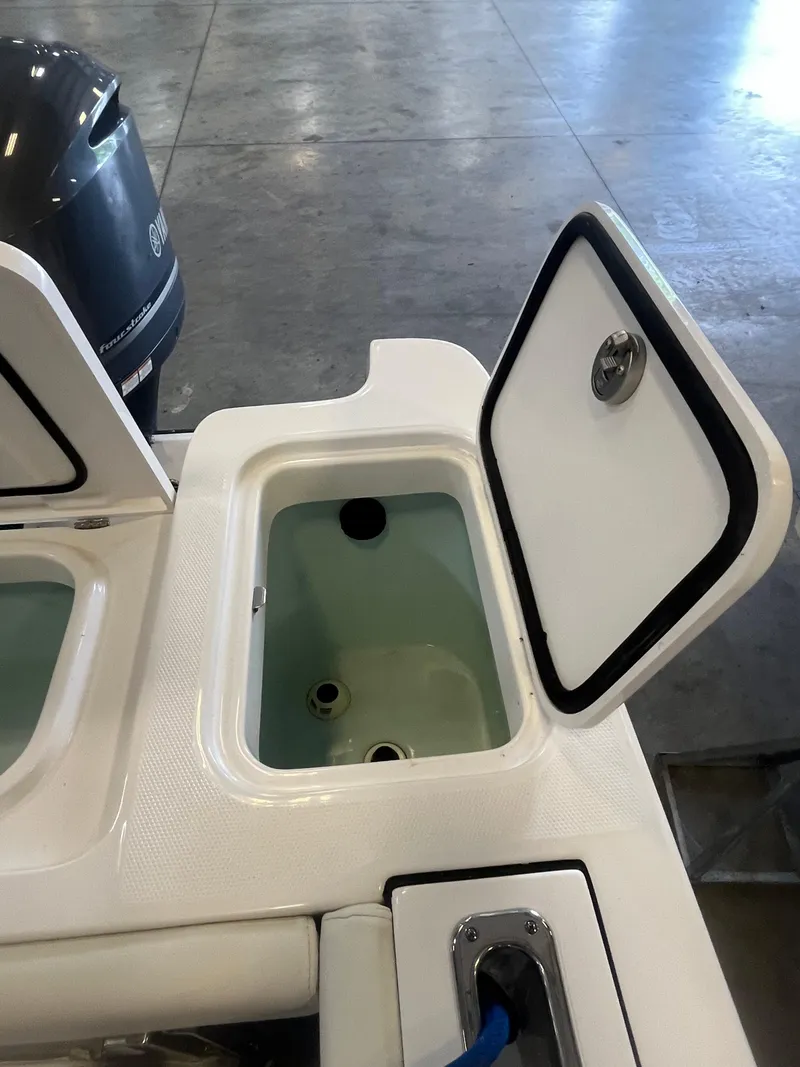 Slide: The Image of Open storage compartment on 2020 Edgewater 320CC boat, showcasing interior details. - 20