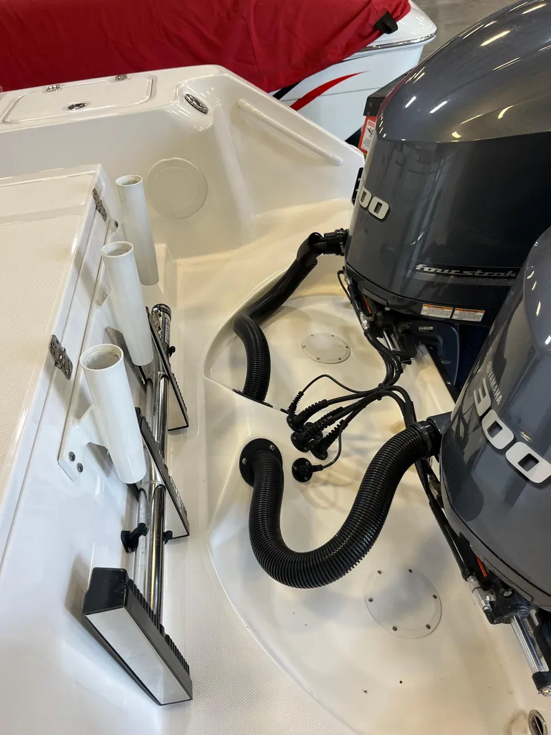 Slide: The Image of Edgewater 320CC 2020 boat with dual 300 horsepower engines and rod holders. - 24