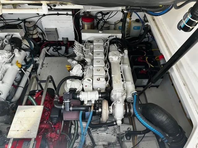 Slide: The Image of 2003 Tiara Yachts 3500 Express engine compartment with dual engines visible. - 10