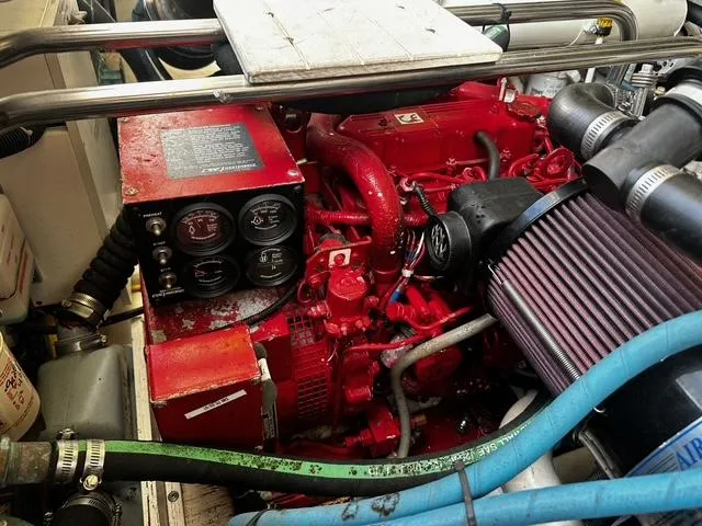 Slide: The Image of Engine compartment of a 2003 Tiara Yachts 3500 Express, showcasing detailed mechanical components. - 11