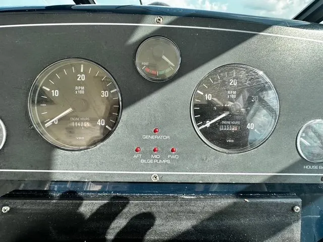 Slide: The Image of 2003 Tiara Yachts 3500 Express interior kitchen with wood cabinetry and modern appliances. - 19