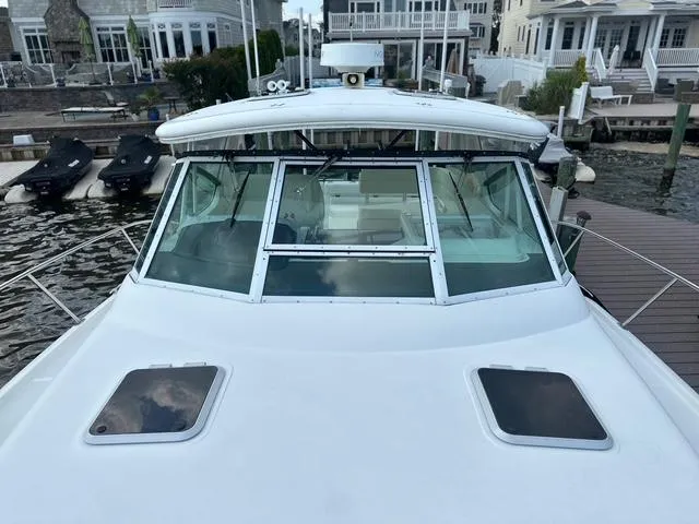 Slide: The Image of 2003 Tiara Yachts 3500 Express boat deck overlooking calm water. - 22