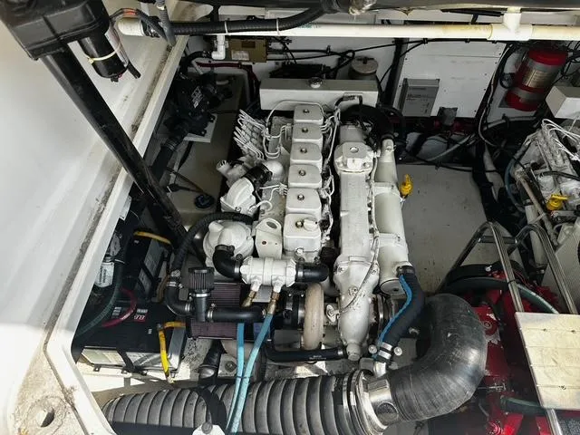 Slide: The Image of 2003 Tiara Yachts 3500 Express interior with seating and helm, showcasing luxury marine design. - 9