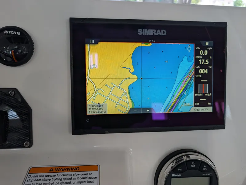 Slide: The Image of Simrad navigation display on 2018 Yamaha Boats 210 FSH Sport dashboard. - 7