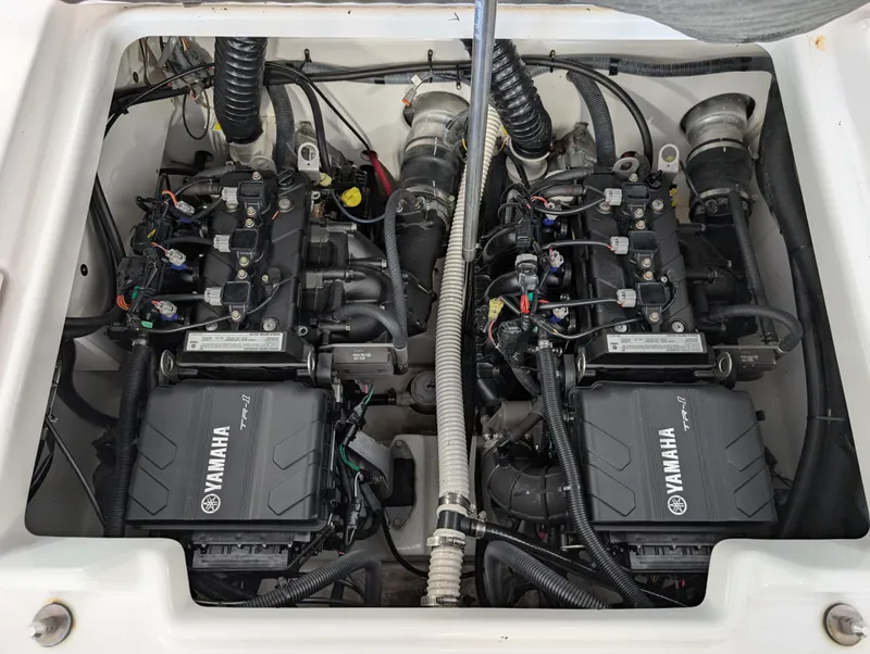 Slide: The Image of 2018 Yamaha Boats 210 FSH Sport engine compartment with dual Yamaha TR-1 engines. - 9