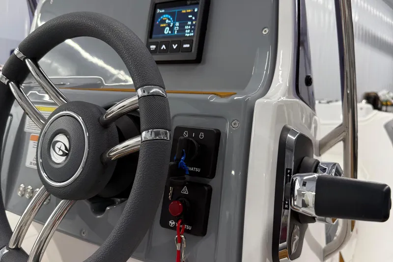 Slide: The Image of Steering console of 2026 Gala V500 boat with modern controls and display. - 12