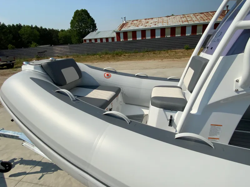 Slide: The Image of Gala V500 inflatable boat, 2026 model, with seating, outdoors near a rustic building. - 5