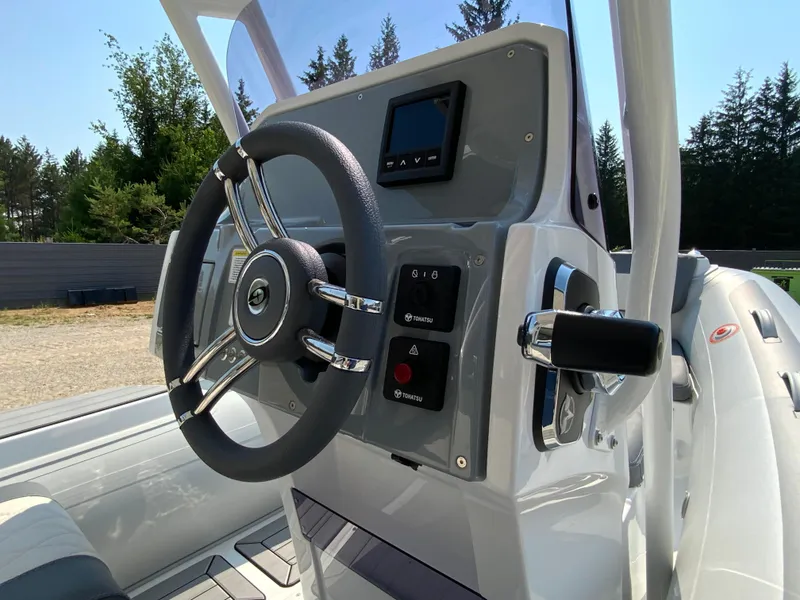 Slide: The Image of Steering console of 2026 Gala V500 boat with modern controls and sleek design. - 7