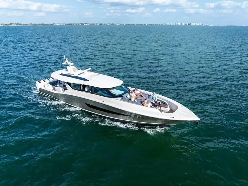 Slide: The Image of 2025 Scout 670 LXS luxury yacht cruising on open water under a clear sky. - 15
