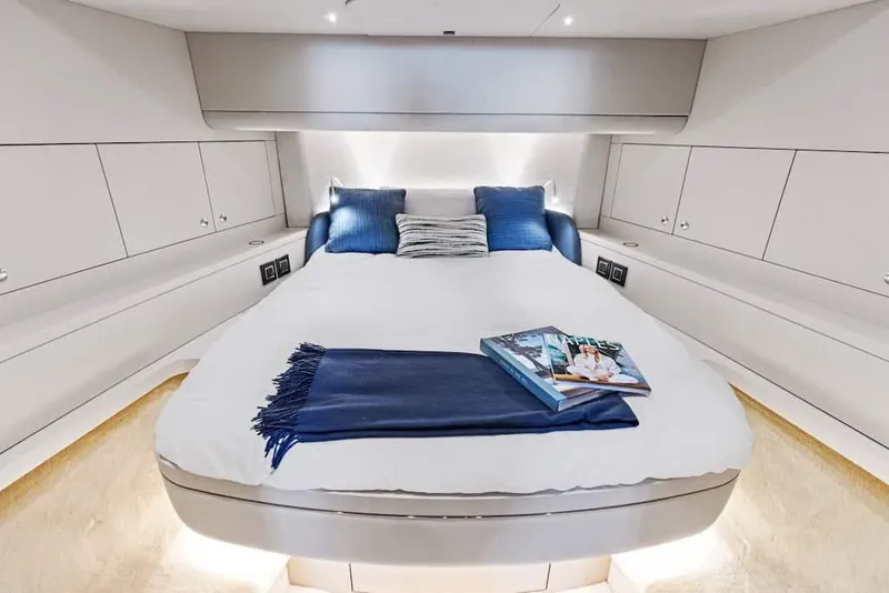 Slide: The Image of Luxurious cabin interior of 2025 Scout 670 LXS yacht with cozy bed and elegant decor. - 5