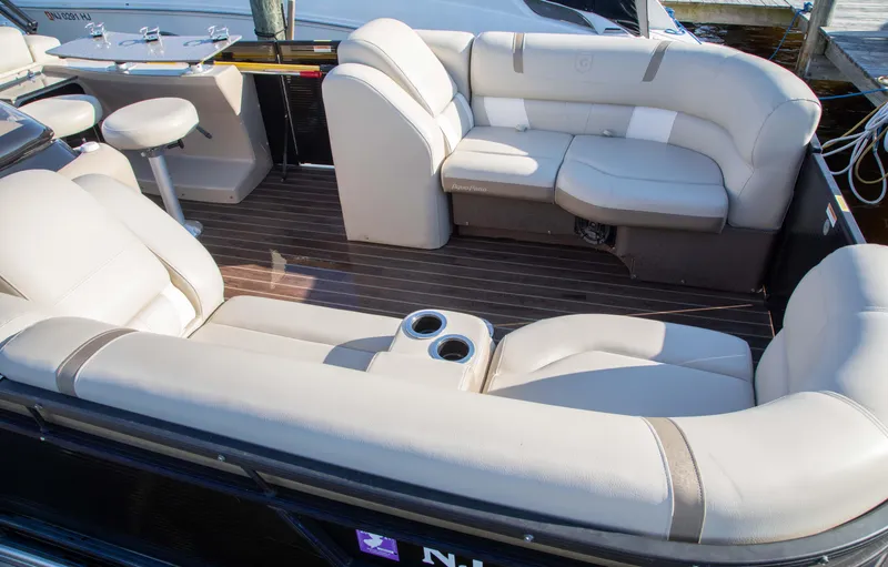 Slide: The Image of Luxurious seating area on a 2018 Godfrey 255 ULB boat with elegant upholstery. - 14