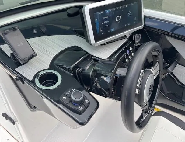 Slide: The Image of 2023 Yamaha Boats 222SD dashboard with touchscreen, steering wheel, and control panel. - 21