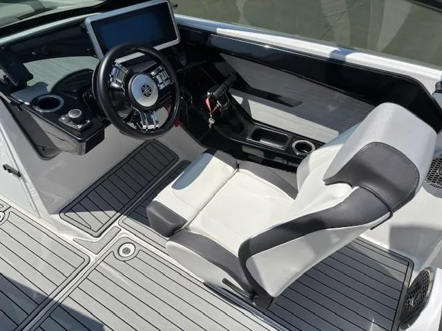 Slide: The Image of 2023 Yamaha Boats 222SD cockpit with modern steering and seating. - 27