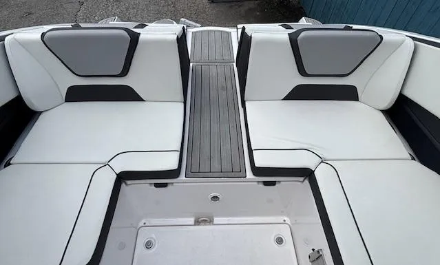 Slide: The Image of 2023 Yamaha Boats 222SD interior with white seating and sleek design. - 38